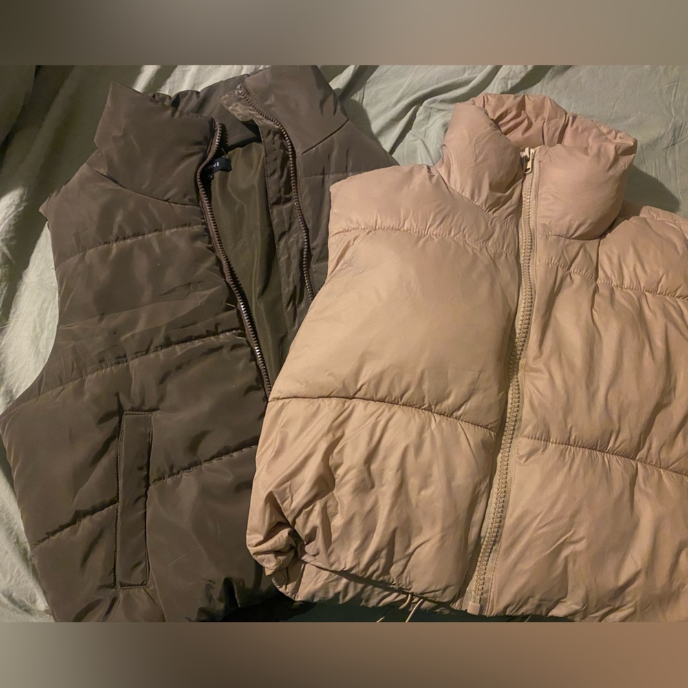 Two cropped trendy puffer vests